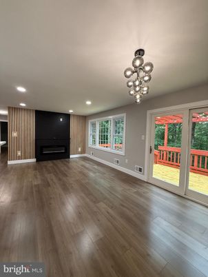 Empty room, Fireplace, Interior, Pendant Lights, Recessed Lighting, Wood Texture Flooring