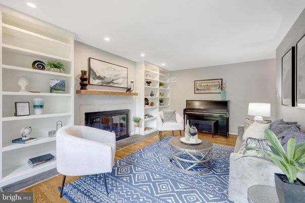 Fireplace, Interior, Living room, Piano, Recessed Lighting, Wood Texture Flooring