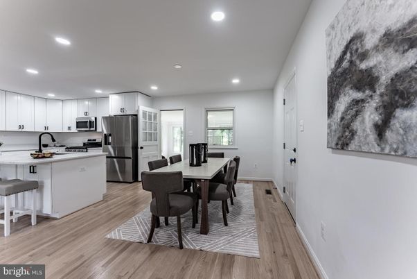 Dining room, Interior, Kitchen, Recessed Lighting, Stainless Steel Appliances, Wood Texture Flooring