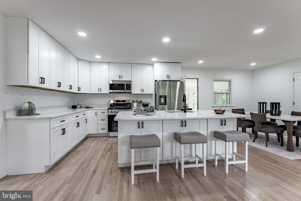 Dining room, Interior, Kitchen, Recessed Lighting, Stainless Steel Appliances, Wood Texture Flooring