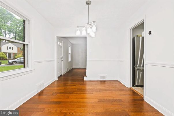 Empty room, Interior, Kitchen, Pendant Lights, Stainless Steel Appliances, Wood Texture Flooring