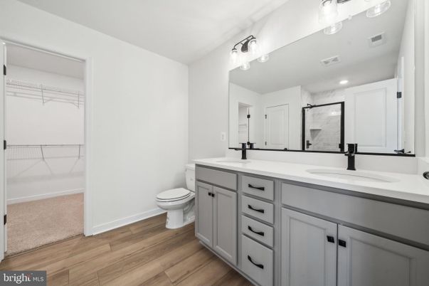 Bathroom, Dual Sink Vanities, Interior, Recessed Lighting, Wood Texture Flooring