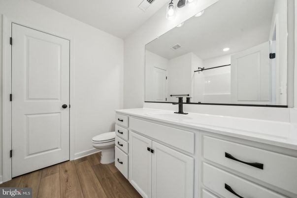 Bathroom, Dual Sink Vanities, Interior, Recessed Lighting, Wood Texture Flooring