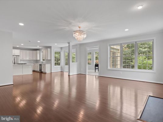 Chandelier, Empty room, Interior, Kitchen, Recessed Lighting, Stainless Steel Appliances, Wood Texture Flooring
