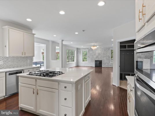 Fireplace, Interior, Kitchen, Recessed Lighting, Stainless Steel Appliances, Wood Texture Flooring