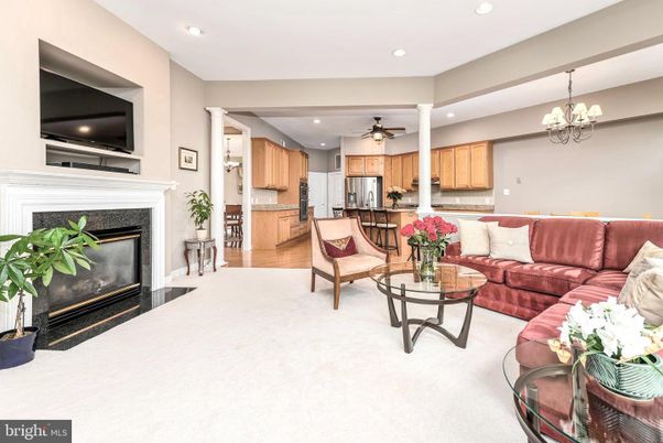 Chandelier, Dining room, Fireplace, Interior, Kitchen, Living room, Recessed Lighting, Stainless Steel Appliances, Wood Texture Flooring