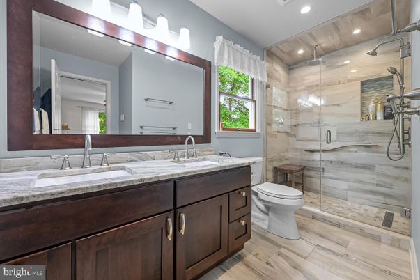 Bathroom, Dual Sink Vanities, Glass Shower, Interior, Recessed Lighting, Wood Texture Flooring