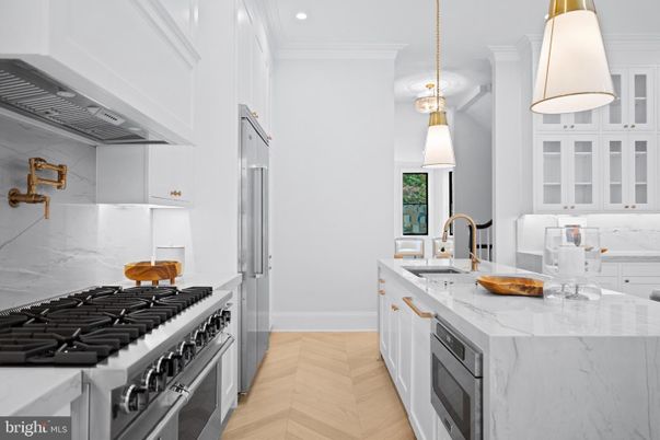 Interior, Kitchen, Marble Walls, Pendant Lights, Recessed Lighting, Stainless Steel Appliances, Wood Texture Flooring