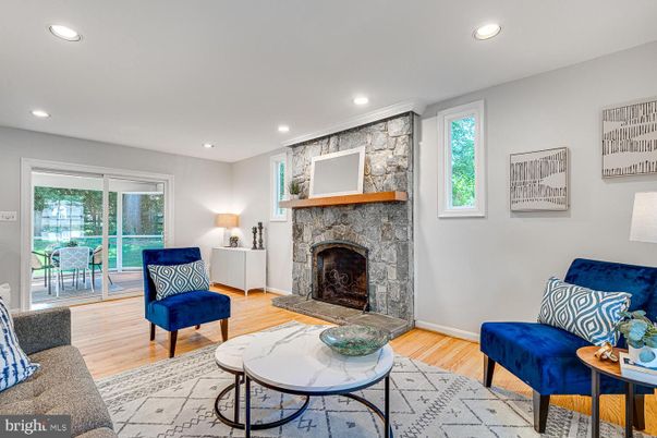 Fireplace, Interior, Living room, Recessed Lighting, Stone Walls, Wood Texture Flooring