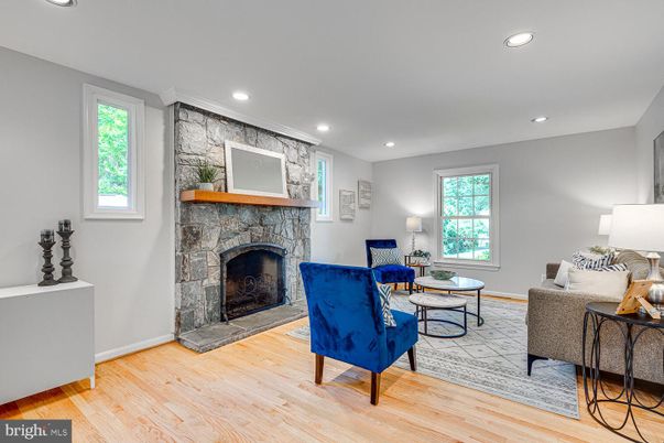 Fireplace, Interior, Living room, Recessed Lighting, Stone Walls, Wood Texture Flooring