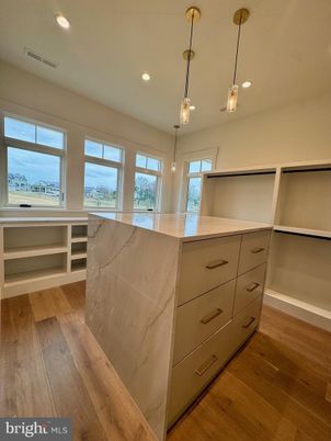 Interior, Marble Walls, Pendant Lights, Recessed Lighting, Wood Texture Flooring
