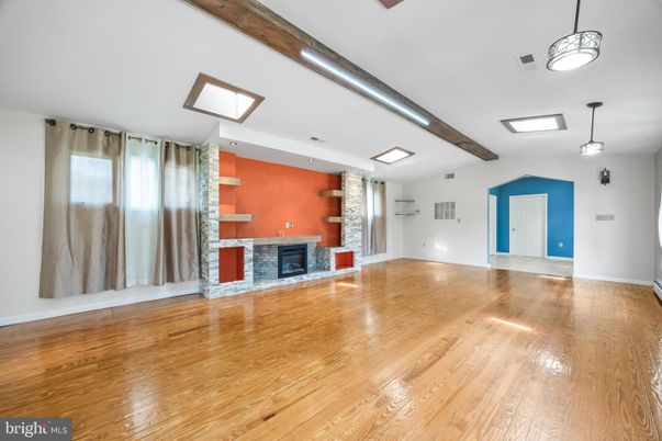 Empty room, Fireplace, Interior, Pendant Lights, Recessed Lighting, Wooden Beams, Wood Texture Flooring