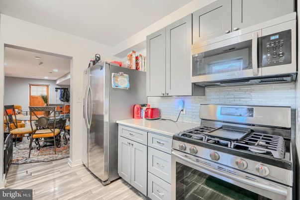 Dining room, Interior, Kitchen, Recessed Lighting, Stainless Steel Appliances, Wood Texture Flooring