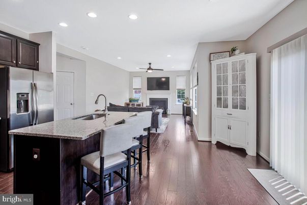 Fireplace, Interior, Kitchen, Recessed Lighting, Stainless Steel Appliances, Wood Texture Flooring