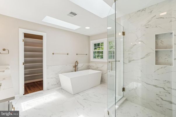 Bathroom, Free Standing Baths, Glass Shower, Interior, Marble, Marble Walls, Recessed Lighting, Wood Texture Flooring