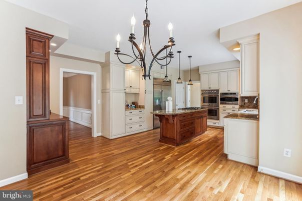 Chandelier, Interior, Kitchen, Recessed Lighting, Stainless Steel Appliances, Wood Texture Flooring