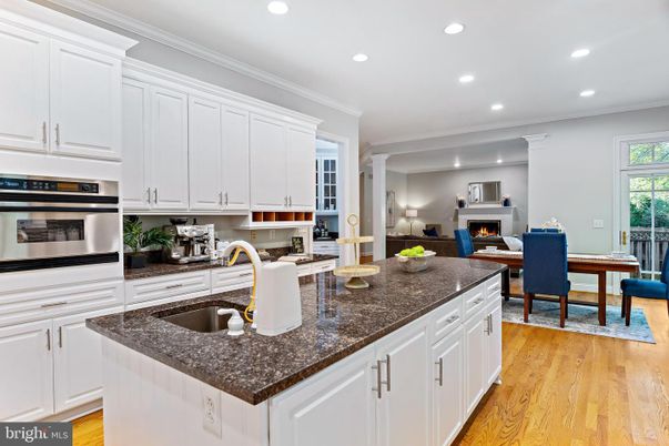 Dining room, Fireplace, Interior, Kitchen, Living room, Recessed Lighting, Stainless Steel Appliances, Wood Texture Flooring