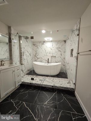 Bathroom, Free Standing Baths, Glass Shower, Interior, Marble, Marble Walls, Recessed Lighting