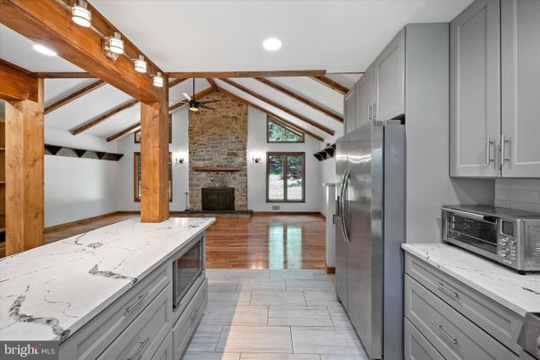 Fireplace, Interior, Kitchen, Recessed Lighting, Stone Walls, Wood Texture Flooring