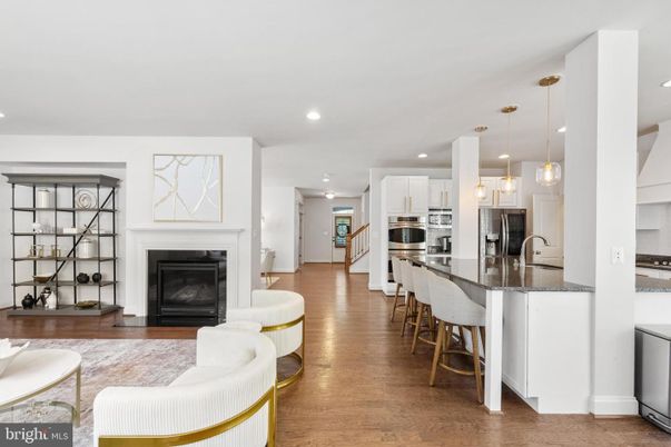Fireplace, Interior, Kitchen, Pendant Lights, Recessed Lighting, Stainless Steel Appliances, Wood Texture Flooring