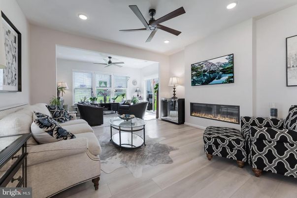 Dining room, Fireplace, Interior, Living room, Recessed Lighting, Wood Texture Flooring