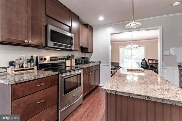 Chandelier, Interior, Kitchen, Pendant Lights, Recessed Lighting, Stainless Steel Appliances, Wood Texture Flooring
