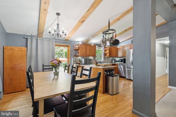 Chandelier, Dining room, Interior, Kitchen, Stainless Steel Appliances, Wooden Beams, Wood Texture Flooring
