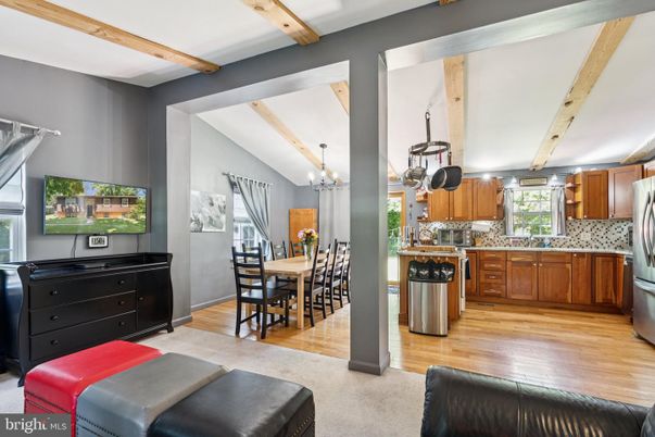 Chandelier, Dining room, Interior, Kitchen, Stainless Steel Appliances, Wooden Beams, Wood Texture Flooring