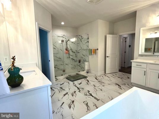 Bathroom, Dual Sink Vanities, Glass Shower, Interior, Marble, Marble Walls, Recessed Lighting