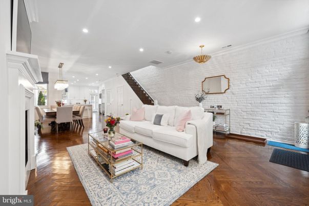 Chandelier, Dining room, Interior, Living room, Pendant Lights, Recessed Lighting, Stone Walls, Wood Texture Flooring