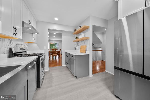 Dining room, Interior, Kitchen, Recessed Lighting, Stainless Steel Appliances, Wood Texture Flooring