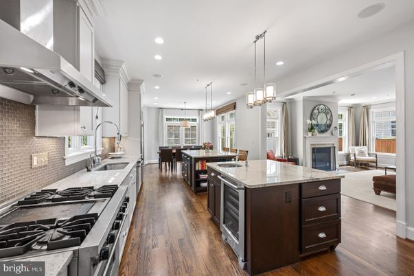 Dining room, Fireplace, Interior, Kitchen, Living room, Pendant Lights, Recessed Lighting, Stainless Steel Appliances, Wood Texture Flooring