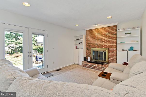 Fireplace, Interior, Living room, Recessed Lighting, Stone Walls, Wood Texture Flooring