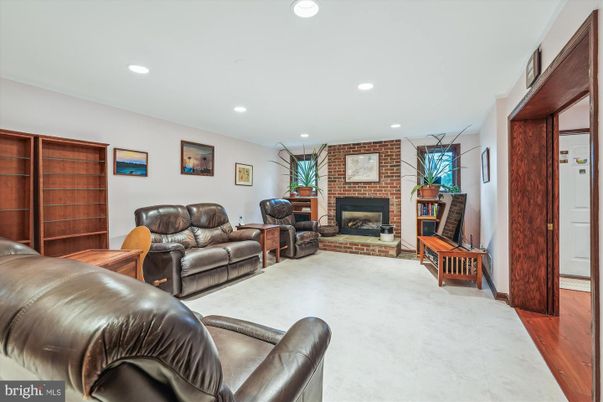 Fireplace, Interior, Living room, Recessed Lighting, Stone Walls, Wood Texture Flooring