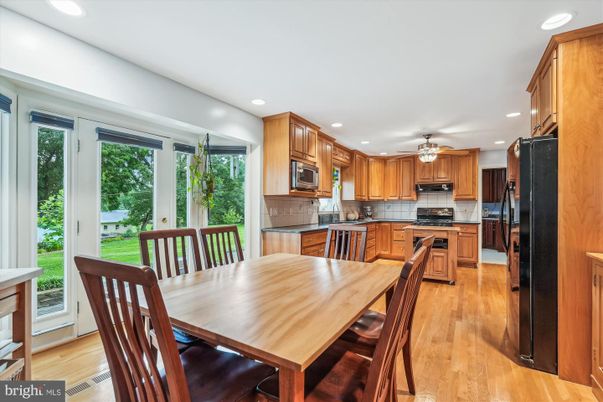 Dining room, Interior, Kitchen, Recessed Lighting, Stainless Steel Appliances, Wood Texture Flooring