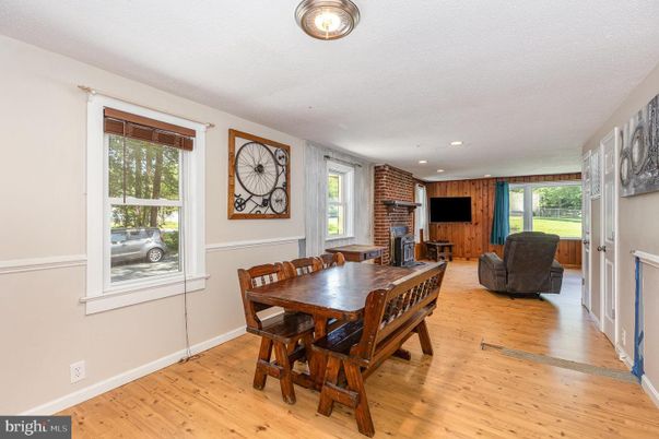 Dining room, Fireplace, Interior, Recessed Lighting, Stone Walls, Wood Texture Flooring