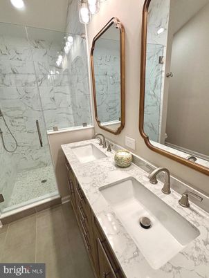 Bathroom, Dual Sink Vanities, Glass Shower, Interior, Marble Walls, Recessed Lighting