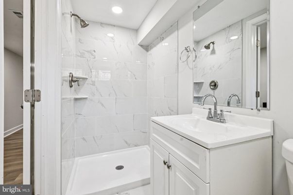 Bathroom, Interior, Marble Walls, Recessed Lighting, Wood Texture Flooring