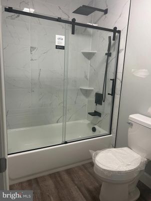 Bathroom, Glass Shower, Interior, Marble Walls, Wood Texture Flooring
