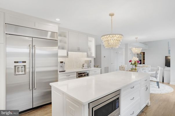 Chandelier, Dining room, Interior, Kitchen, Recessed Lighting, Stainless Steel Appliances, Wood Texture Flooring