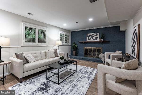 Fireplace, Interior, Living room, Recessed Lighting, Stone Walls, Wood Texture Flooring
