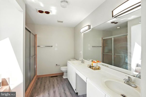 Bathroom, Dual Sink Vanities, Glass Shower, Interior, Recessed Lighting, Wood Texture Flooring