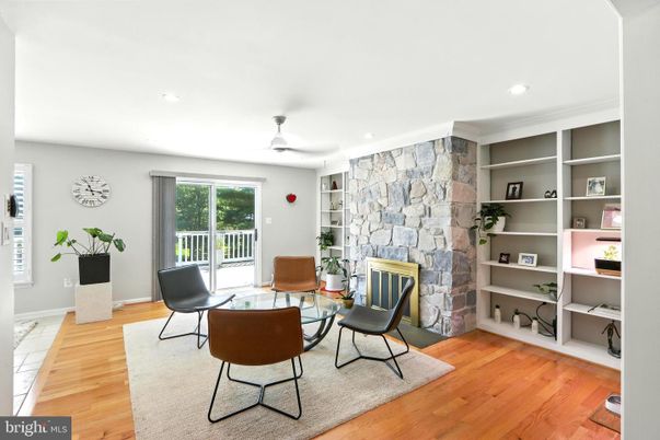 Dining room, Fireplace, Interior, Recessed Lighting, Stone Walls, Wood Texture Flooring