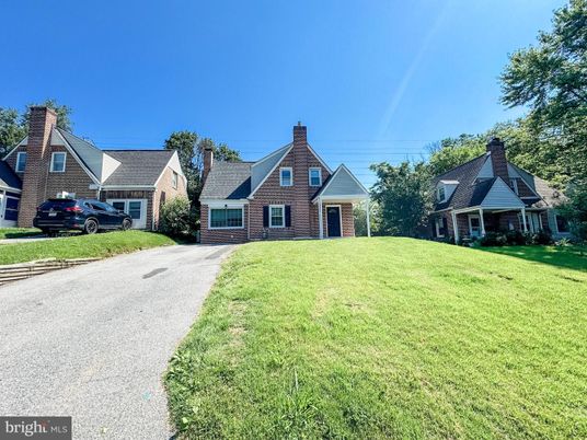 Attached, Backyard, Exterior, Facade, Brick Facade, Tudor Revival