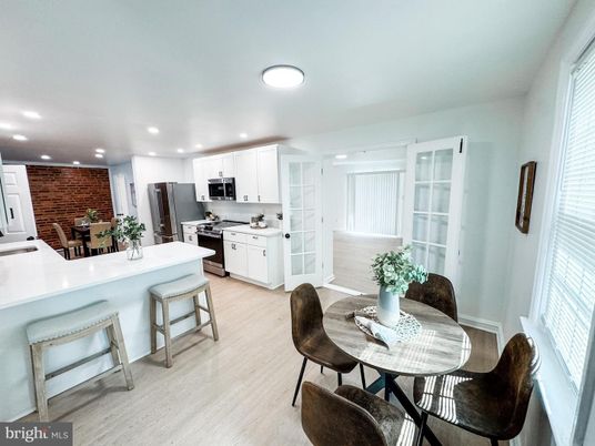 Dining room, Interior, Kitchen, Recessed Lighting, Stainless Steel Appliances, Stone Walls, Wood Texture Flooring