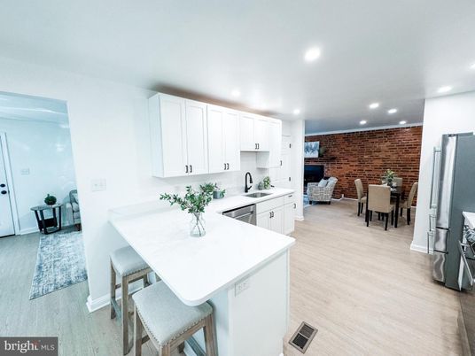 Dining room, Interior, Kitchen, Recessed Lighting, Stainless Steel Appliances, Stone Walls, Wood Texture Flooring