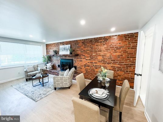Dining room, Fireplace, Interior, Living room, Recessed Lighting, Stone Walls, Wood Texture Flooring