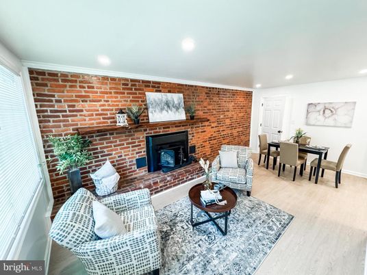 Dining room, Fireplace, Interior, Living room, Recessed Lighting, Stone Walls, Wood Texture Flooring