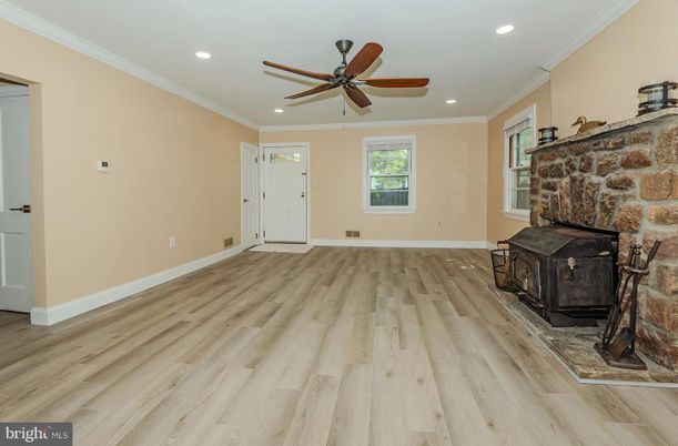 Empty room, Fireplace, Interior, Recessed Lighting, Stone Walls, Wood Texture Flooring