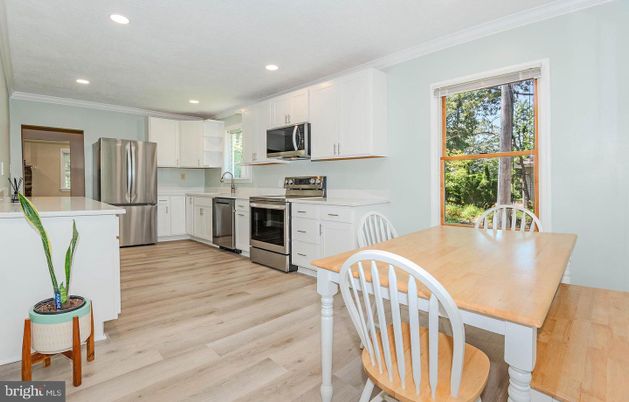 Dining room, Interior, Kitchen, Recessed Lighting, Stainless Steel Appliances, Wood Texture Flooring